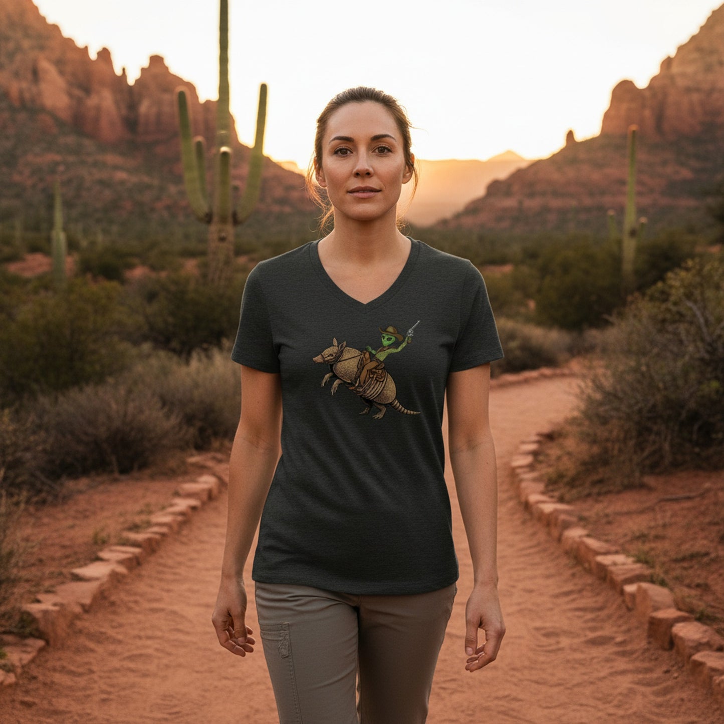 Alien Cowboy Armadillo Rider graphic V-neck tee worn in the Southwest desert